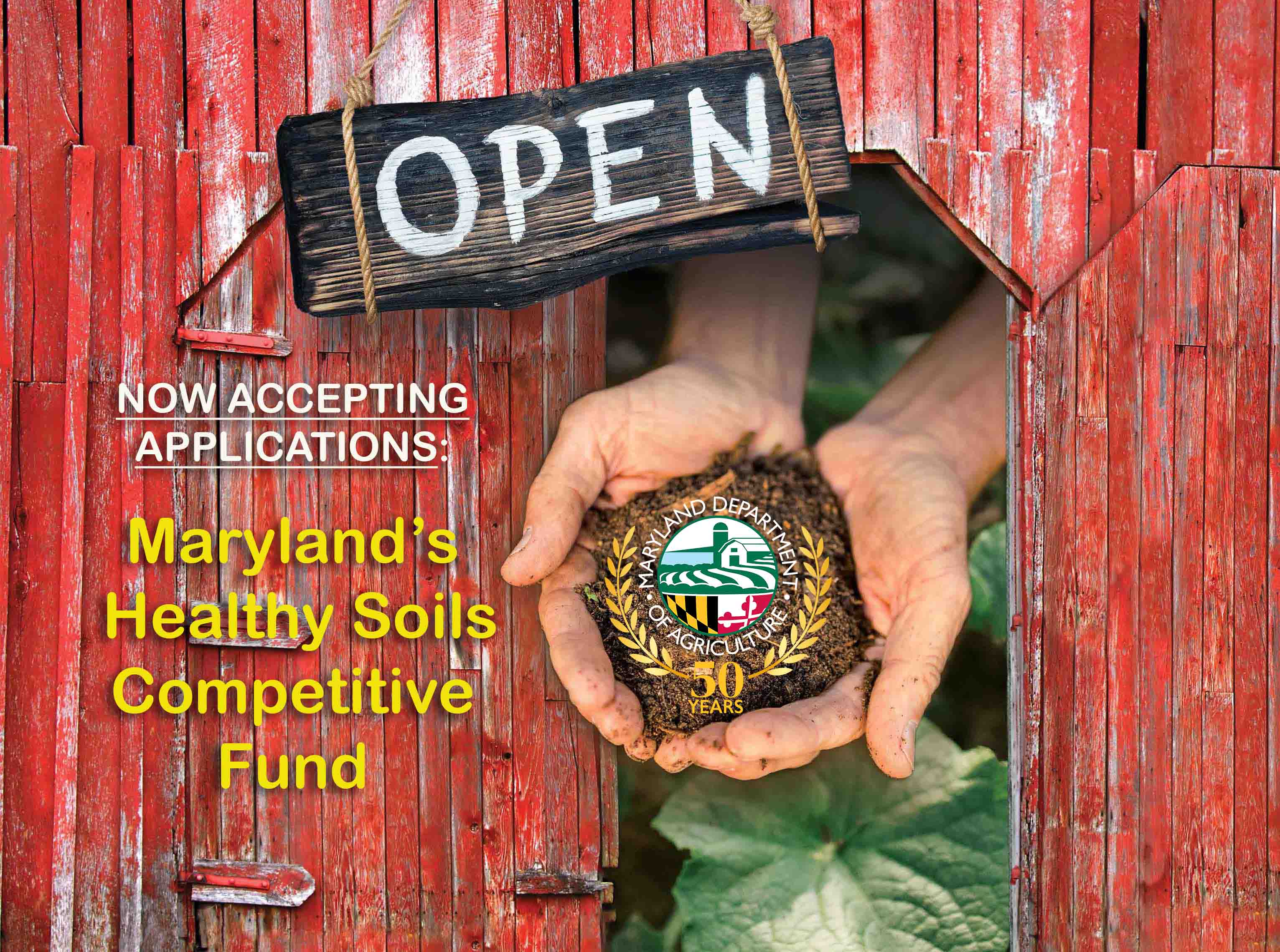 Red bar doors with hands holding soil and Open Sign for Healthy Soils grants 