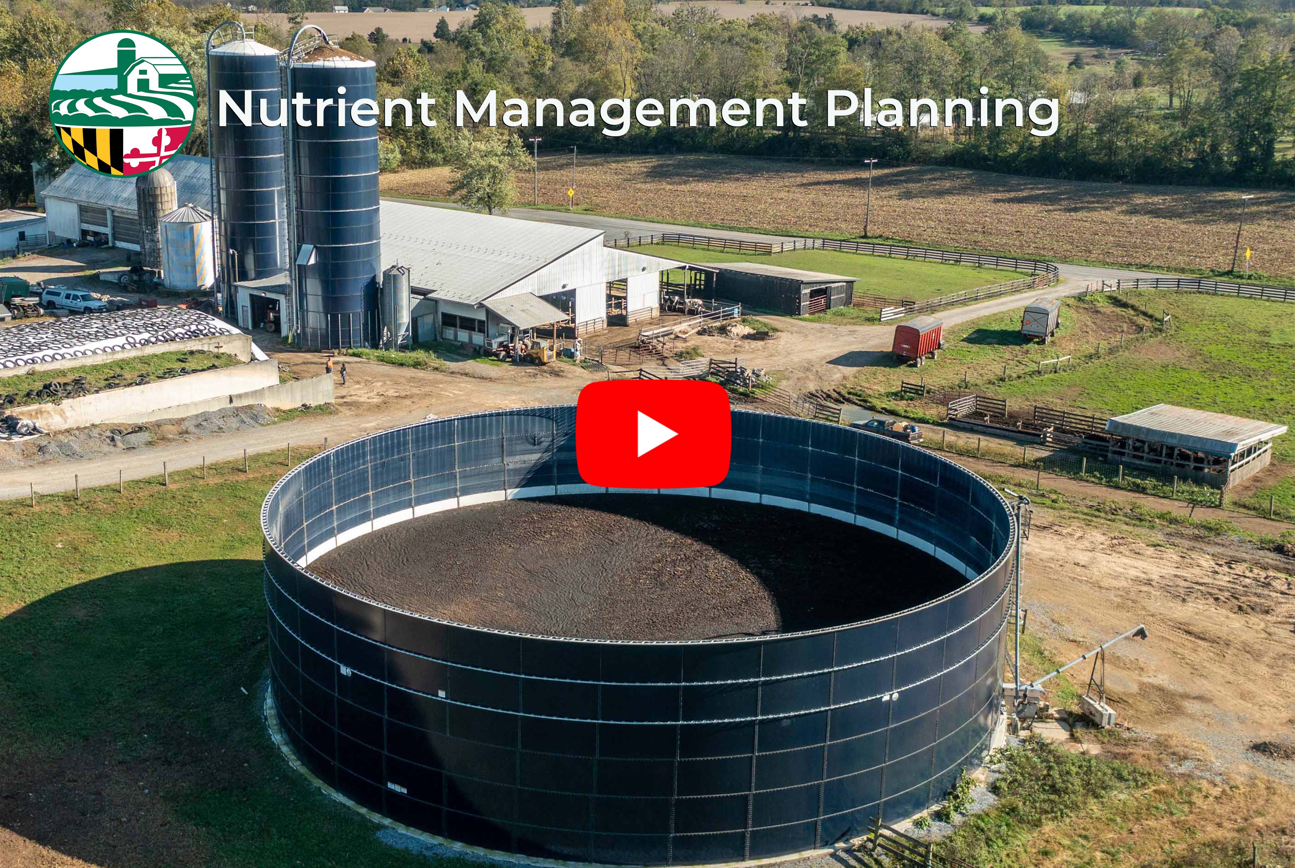 Large round manure pit on a dairy farm with silos, image copyright Edwin Remsberg